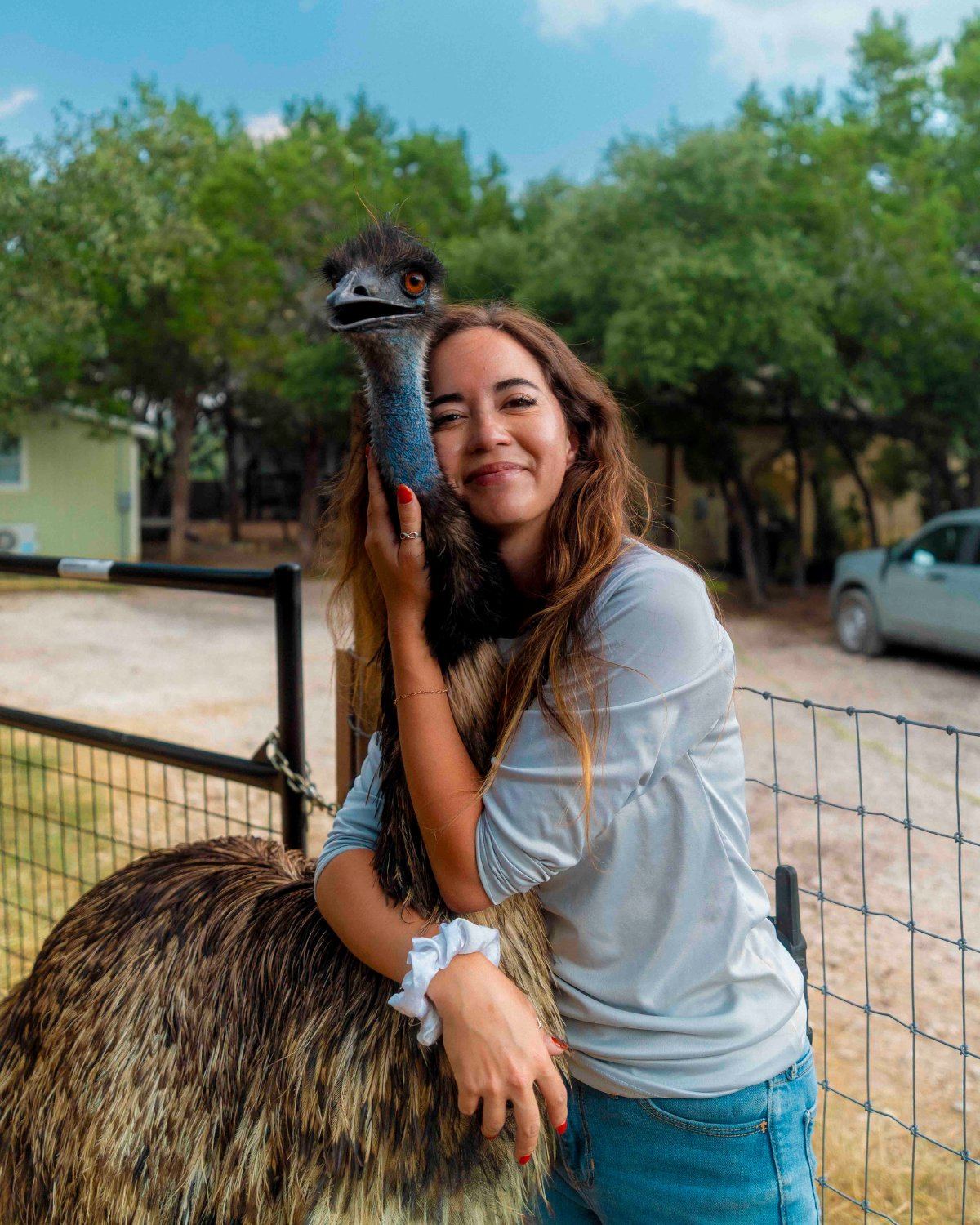 Maya Higa with an emu at Alveus Sanctuary